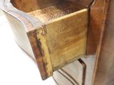 a wooden drawer with a bird feeder inside of it