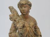statue of a woman holding a bird and a bird in her hand