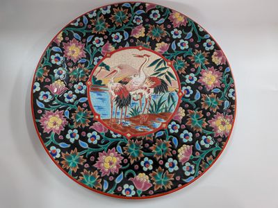 an image of a decorative plate with a painting on it