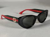 black sunglasses with red and green stripes on the sides of them