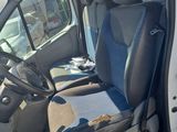 a white van with black seats and a steering wheel
