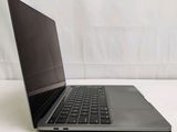a laptop that is sitting on a white surface