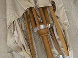 two umbrellas that are sitting on a wooden floor