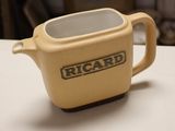 a cream colored teapot with the word ricard on it