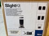 the box is open on the floor with the contents in it