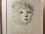 an image of a drawing of a woman ' s face in a gold frame