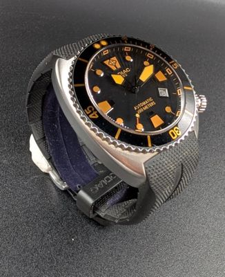 a watch that is sitting on a black surface