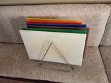 a picture of a stack of colored folders on a couch