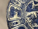 a blue and white plate with a design on it