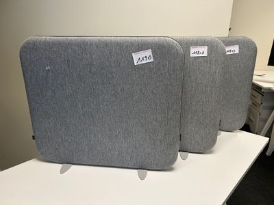 three pieces of luggage sitting on top of a white table