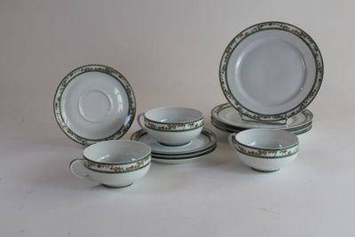 a group of plates and cups sitting on a table