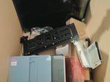 a laptop computer sitting in a box on the floor