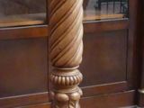 a tall wooden pole with a clock on top of it
