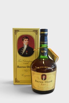 a close up of a bottle of liquor next to a box