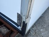 a door with a hole in it that is open