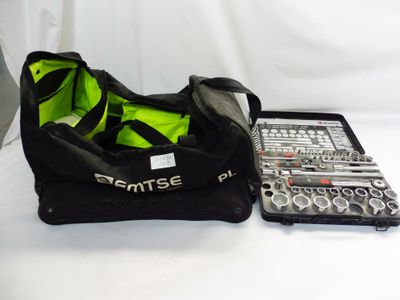 a black bag with tools in it sitting on a table