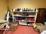 a room with a shelf full of hair products
