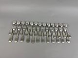 a lot of forks and spoons sitting on a table