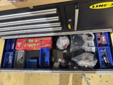 a tool box with tools in it on a table