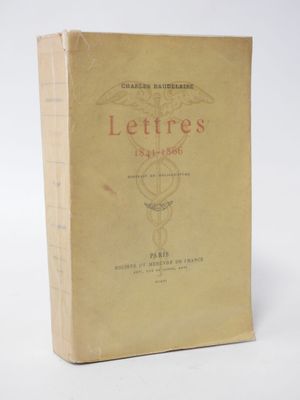 an old book sitting on top of a table next to a white background