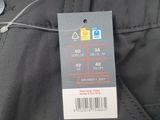 the back of a pair of black pants with a price tag on it