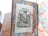 an old book with a picture of a man and a woman on it