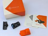 an orange box with a black handle and a white box with a black handle and a red handle and a black and white box with a black handle