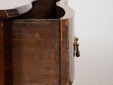 a close up of a wooden table with a drawer underneath it
