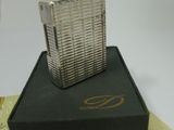 a silver lighter sitting on top of a black box