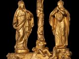 an image of a gold statue of jesus on the cross