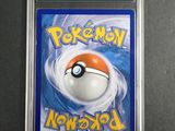 a close up of a pokemon card in a plastic case