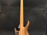 an image of a bass guitar sitting on top of a wooden stand
