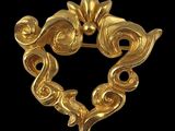 an image of a gold broochle with a heart shaped design