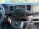 a dashboard of a car with a radio and a steering wheel