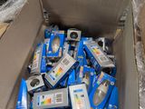 a cardboard box full of electronic equipment in a store