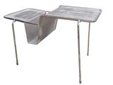 a metal table with a magazine rack on it