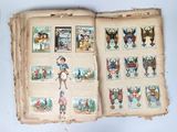 an open book with pictures of animals and people on it