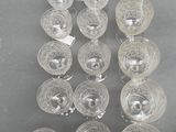 a lot of empty wine glasses sitting on a table