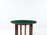 a round table with a wooden base and green glass top