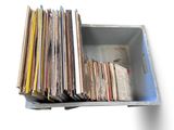a box full of old records sitting on a table