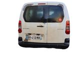 a white van that is parked on the side of the road