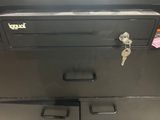 an image of a black filing cabinet with a bunch of keys