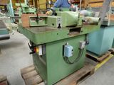 a man that is working on a machine in a factory