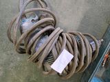 a hose and a box on the ground next to it