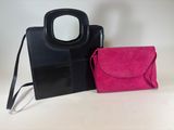 black and pink handbag and purse on a white background