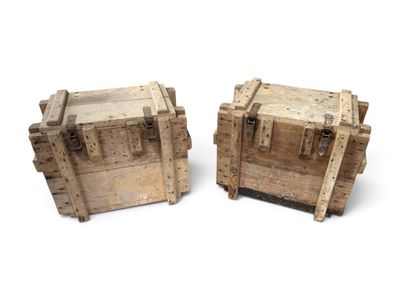 two wooden trunks sitting next to each other on a white surface