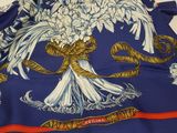 an image of a blue scarf with white flowers on it