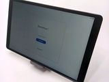 a tablet computer sitting on top of a table