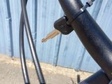 a close up of a bike handle with a key on it