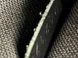 a close up of a black and white photo of a piece of cloth
